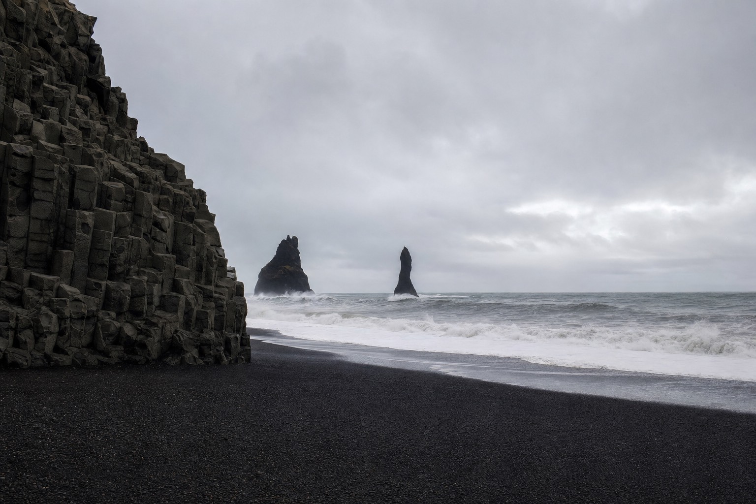 Black sand beach and basalt columns at Reynisfjara in South Coast Iceland