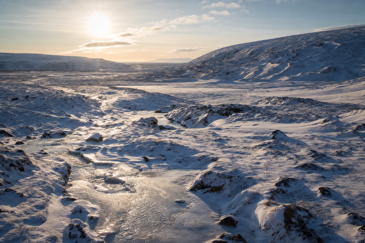 A sweeping view of the Iceland Ring Road cutting through a wide open landscape